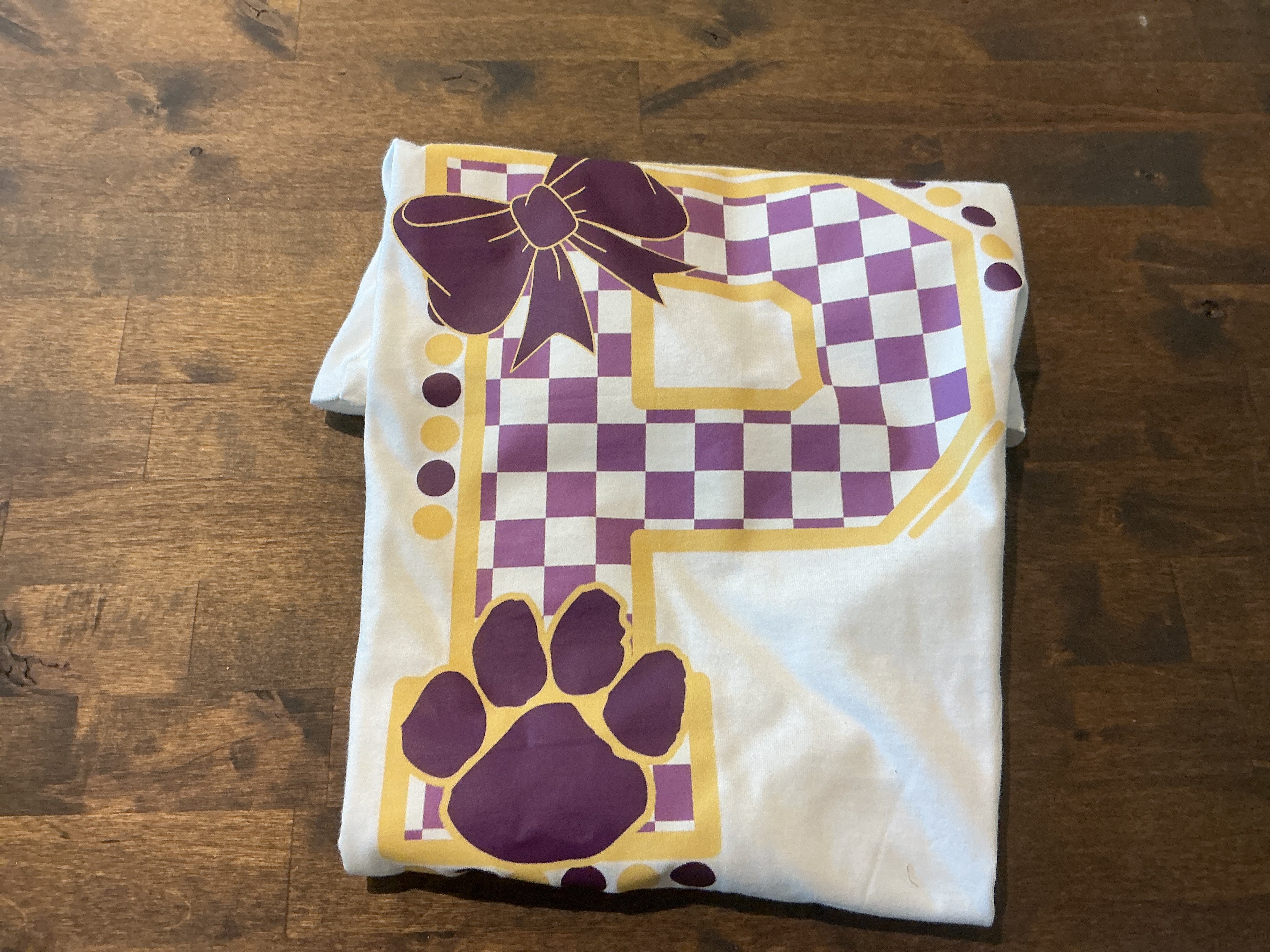 Panther checkered bow tee